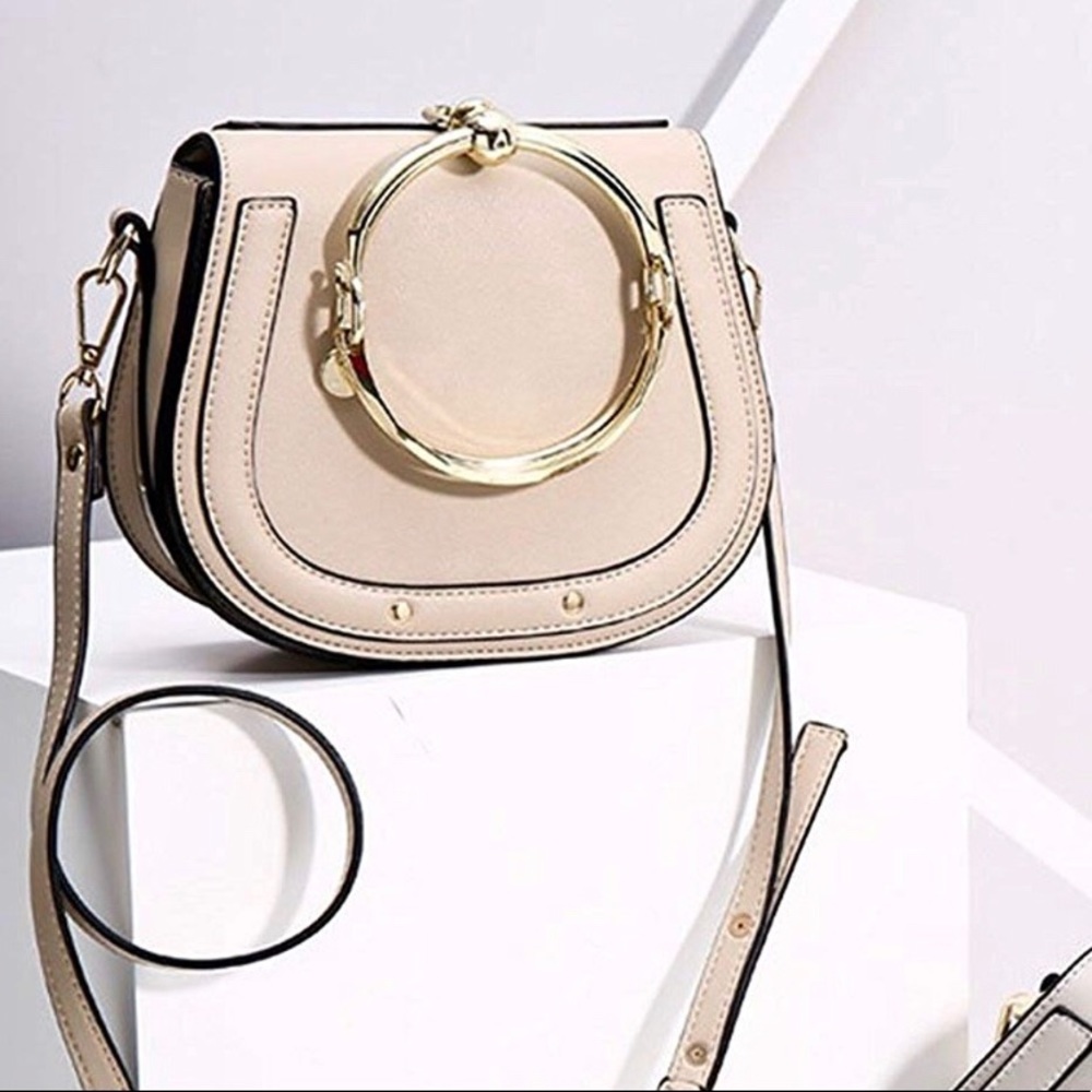 Pink round circular handle purse